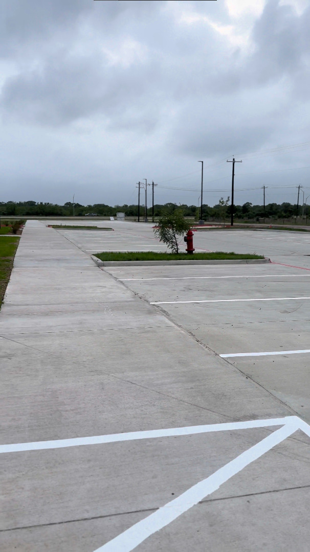 Worker painting crosswalk